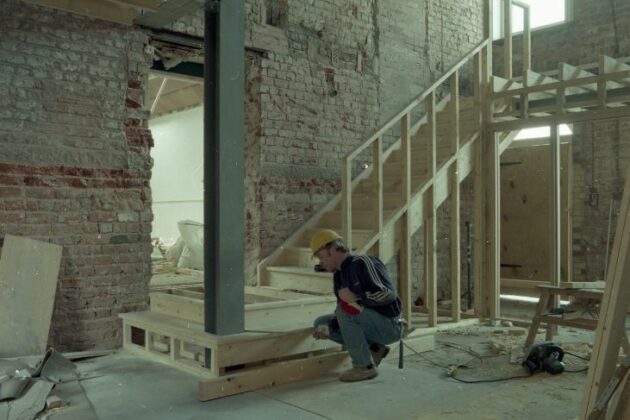 A contractor building the interior of the museum, the area which is now the foyer.