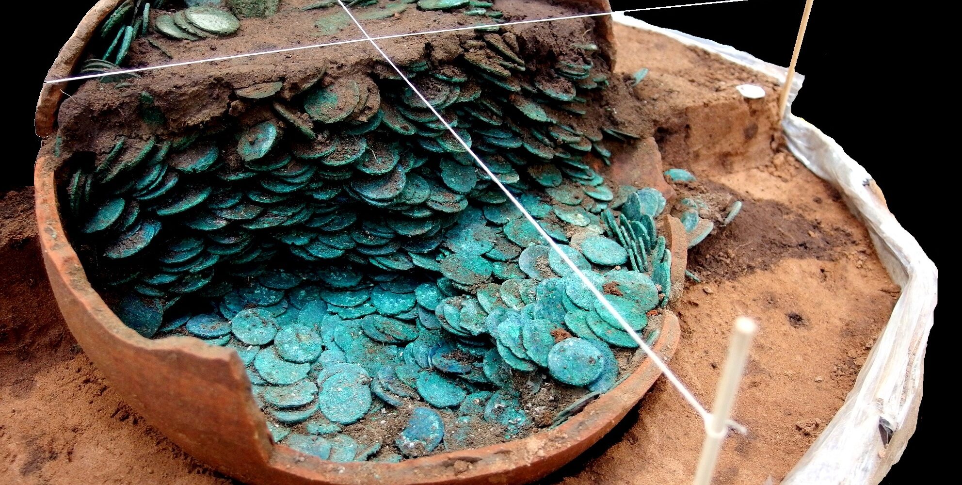 A photograph of the Peover Hoard being excavated