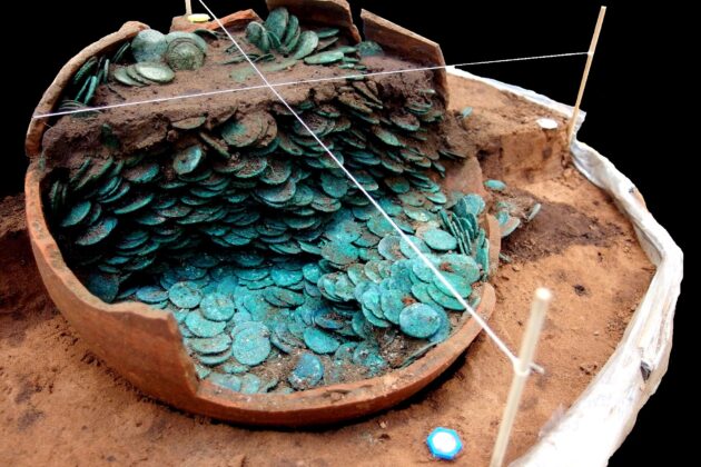 A photograph of the Peover Hoard being excavated