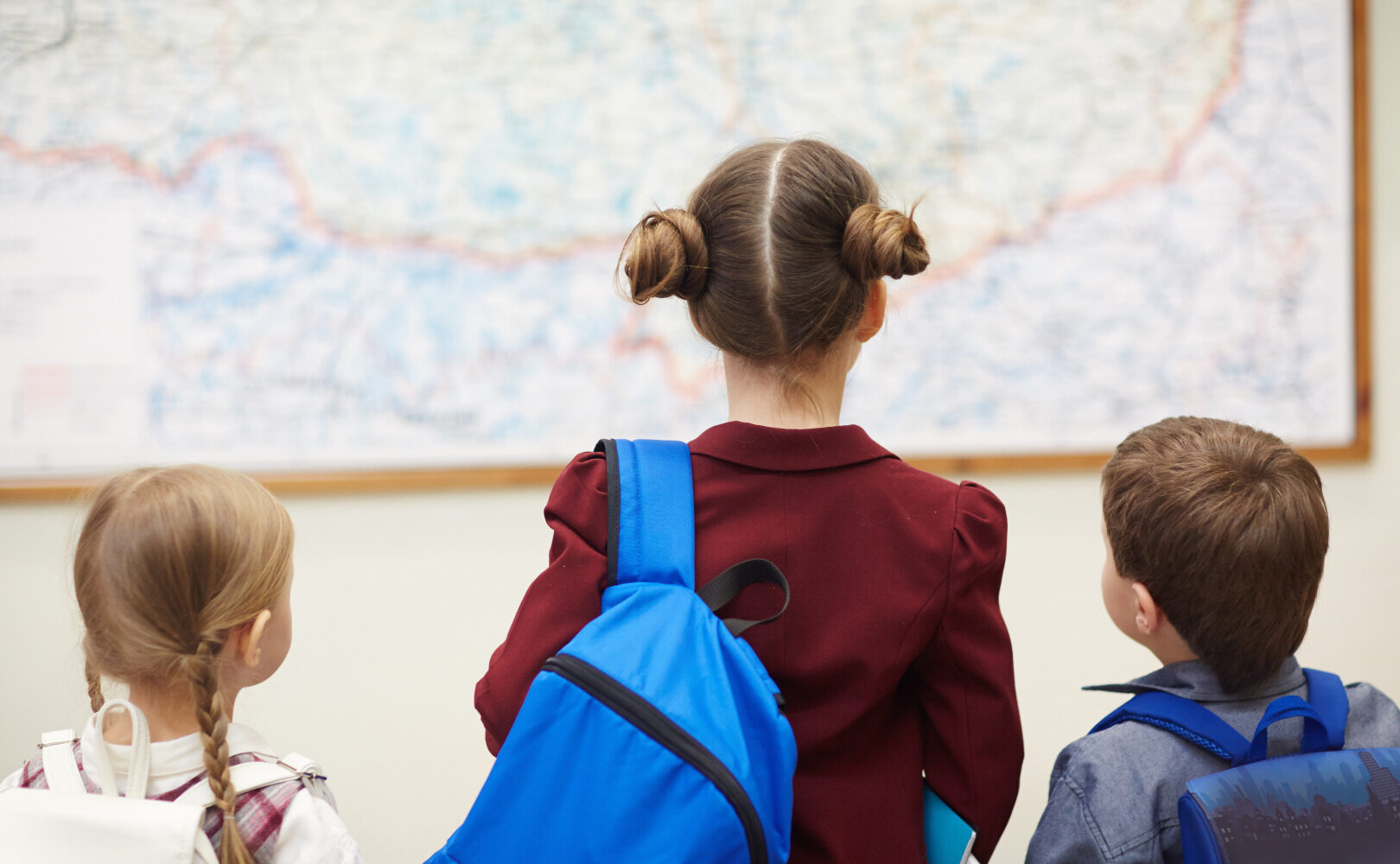 School children looking at a map